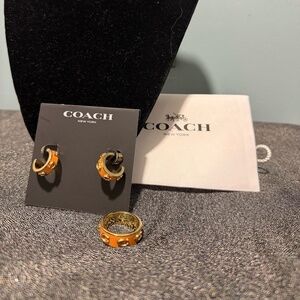 Beautiful Coach matching jewelry set featuring the orange enamel gold-tone hoop
